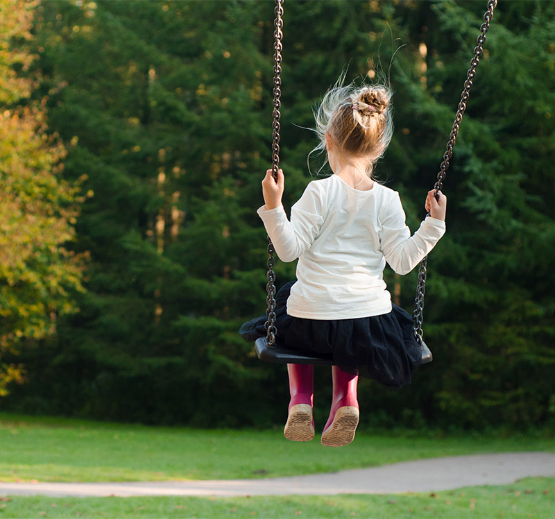 Little girl playing in park