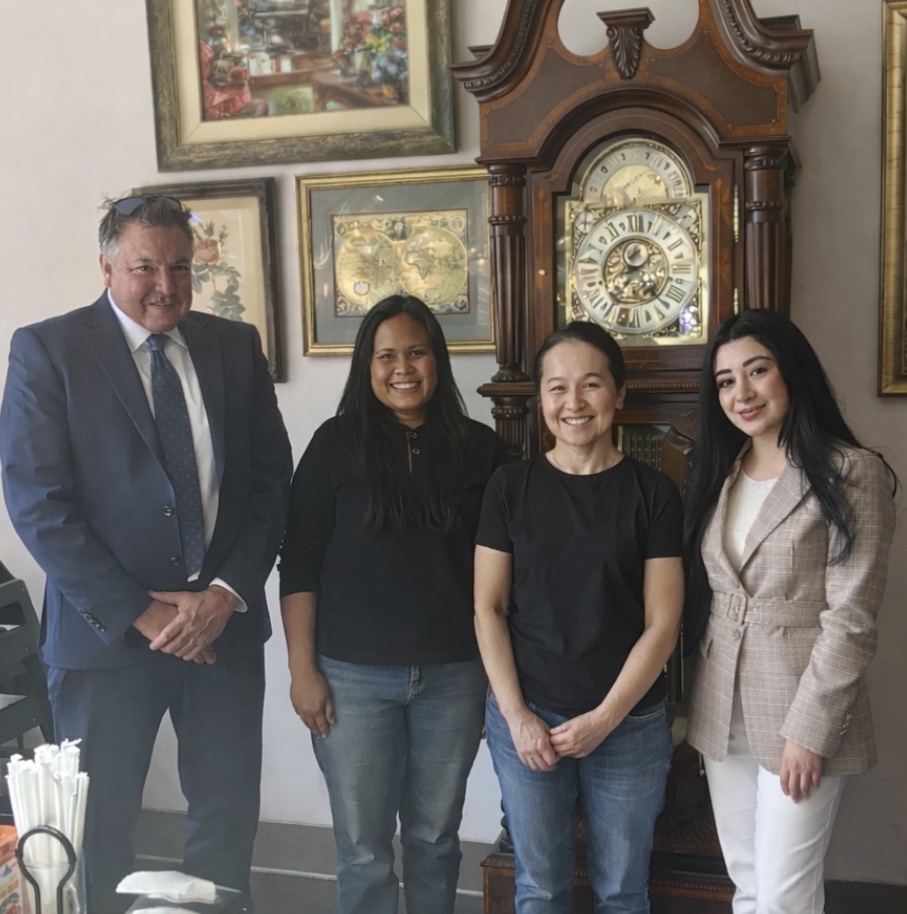 Amarith Farmhouse team with a City of Garden Grove representative