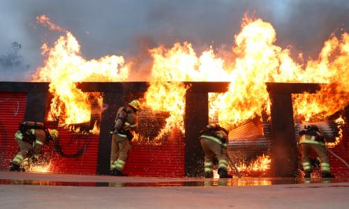Photo of firefighters extinguishing a structure fire.