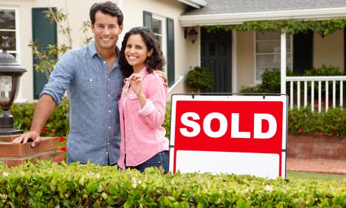 Photo of a couple buying their first home.