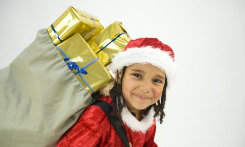 Stock photo of a child celebrating Christmas.