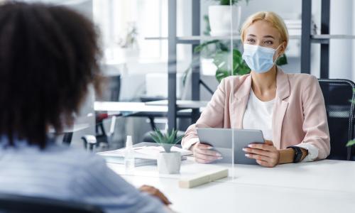 Young woman working in an office workspace.