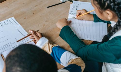 Children doing school work.