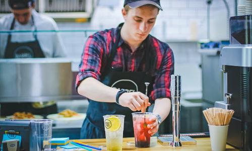 Individual making a drink.