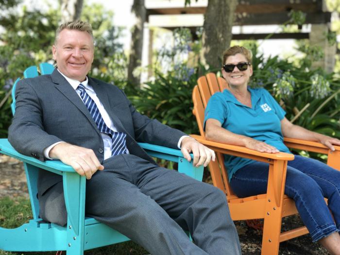 Garden Grove Mayor Steve Jones, with Community Services staff, enjoy the new Adirondack chairs in Civic Center Park. 