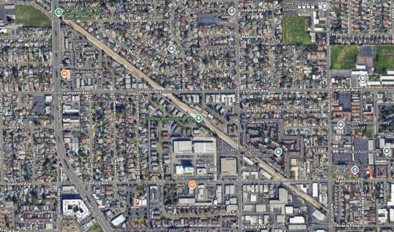 Aerial map view of Garden Grove neighborhood showing streets including Lampson Ave, Stanford Ave, and Park Ave, with Shelley Kensington Park marked near a diagonal freeway corridor.